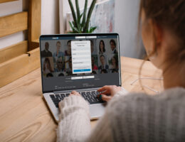 woman updating her linkedin profile on a laptop